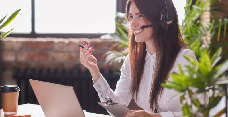 Woman working in call center as dispatcher